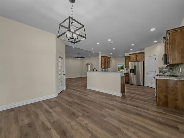 a view of a kitchen cabinets and wooden floor