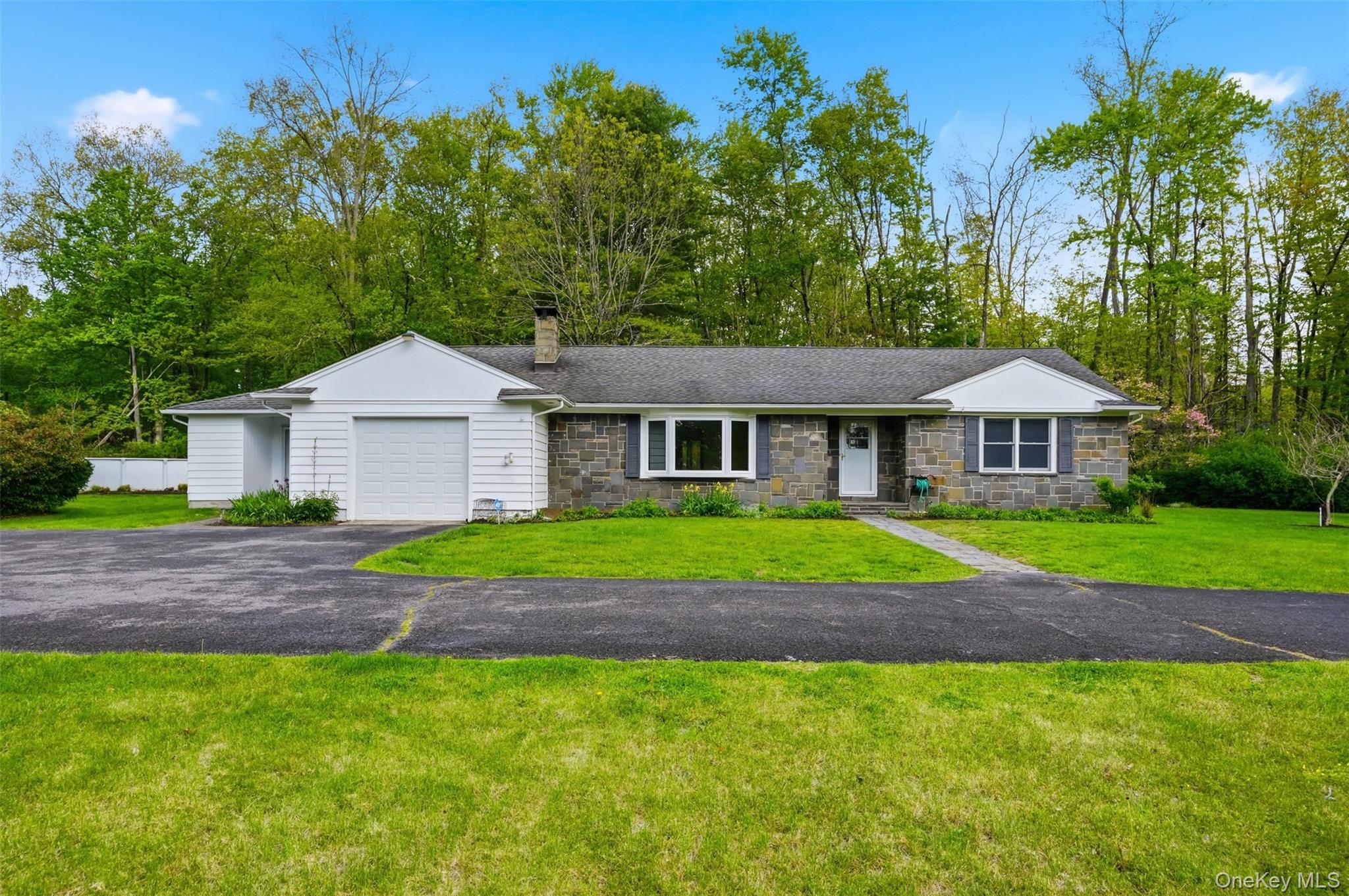 435 Samsonville Road Kerhonkson, NY 12446 - Photo 2 of 37 a front view of a house with a garden