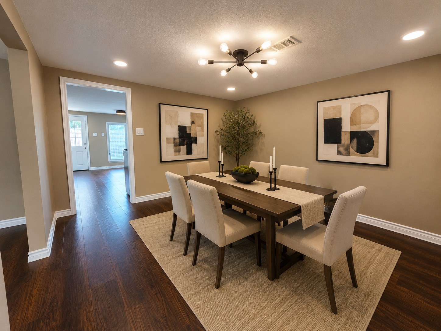 4105 Rutland Street Houston, TX 77018 - Photo 15 of 34 Formal dining room area leading to the kitchen. Virtually staged.