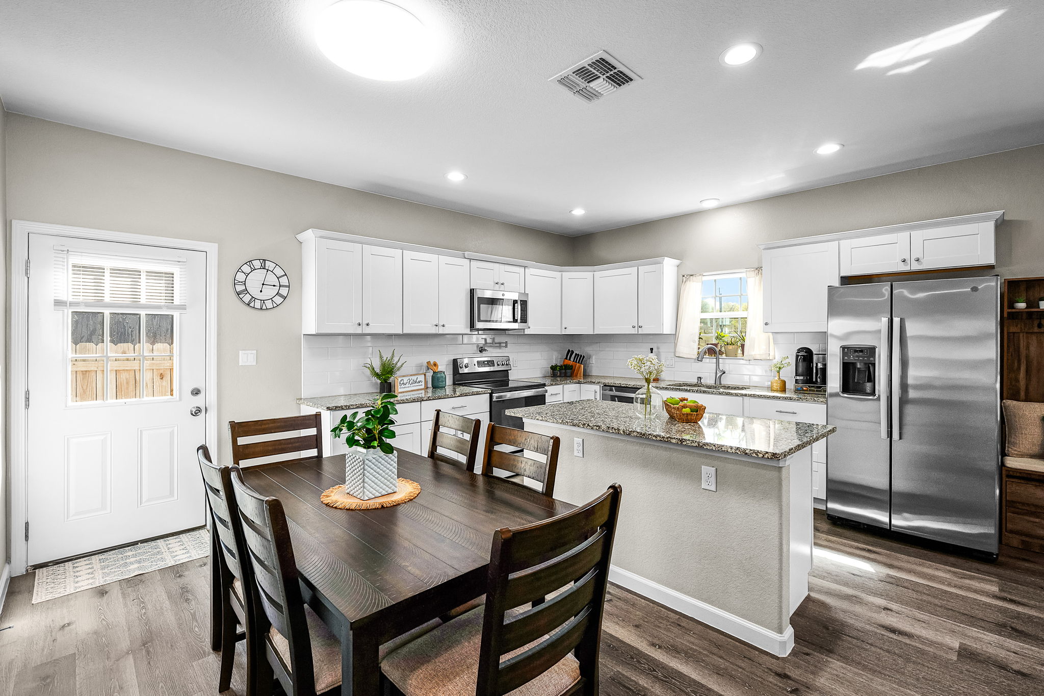 224 Spruce Avenue Luling, TX 78648 - Photo 11 of 31 a view of kitchen with refrigerator and wooden floor