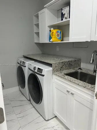 a kitchen with a stove and a sink
