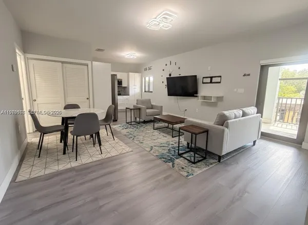 a kitchen with stainless steel appliances cabinets a microwave and a refrigerator