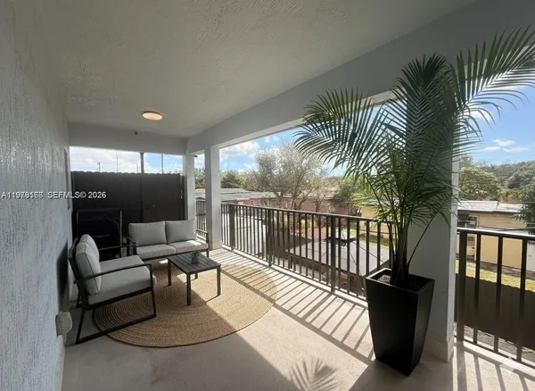a view of a terrace with furniture