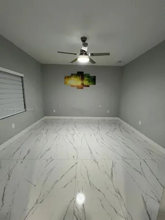 a view of an empty room with a closet