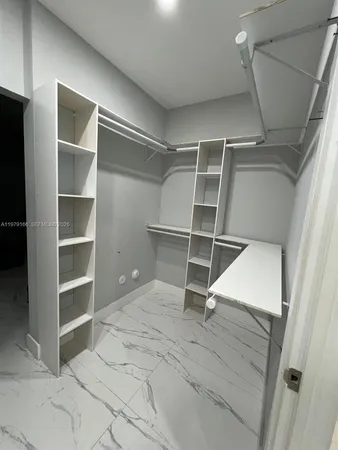a bathroom with a double vanity sink mirror and shower