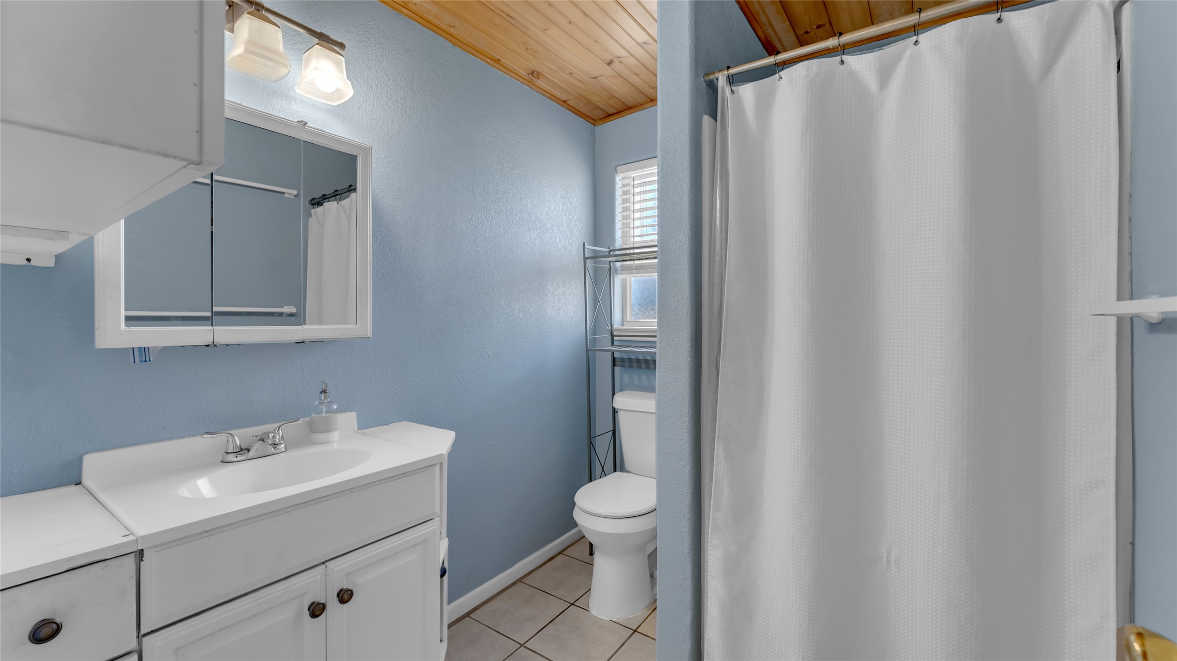 1415 Bee Lane Tow, TX 78672 - Photo 36 of 39 a bathroom with a sink a toilet and shower