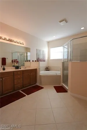a kitchen with a sink a counter top space cabinets and appliances