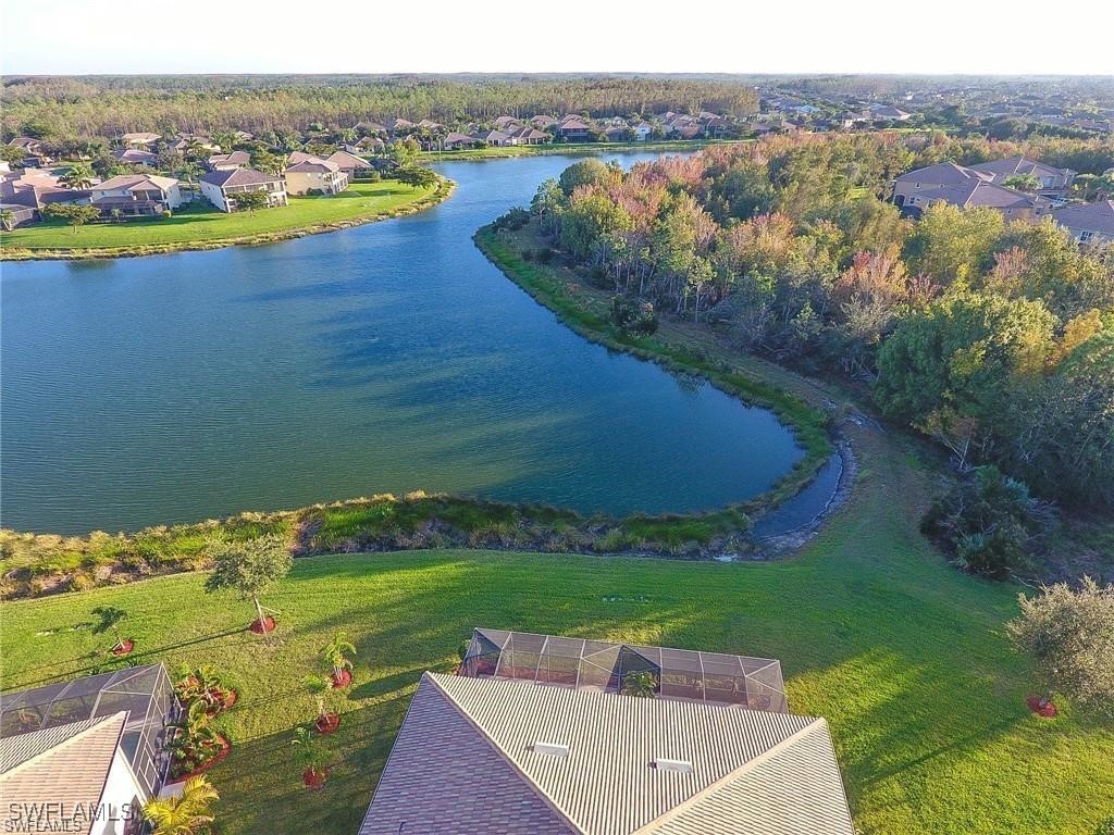 20056 Larino Loop Estero, FL 33928 - Photo 3 of 31 an aerial view of a house with a lake view