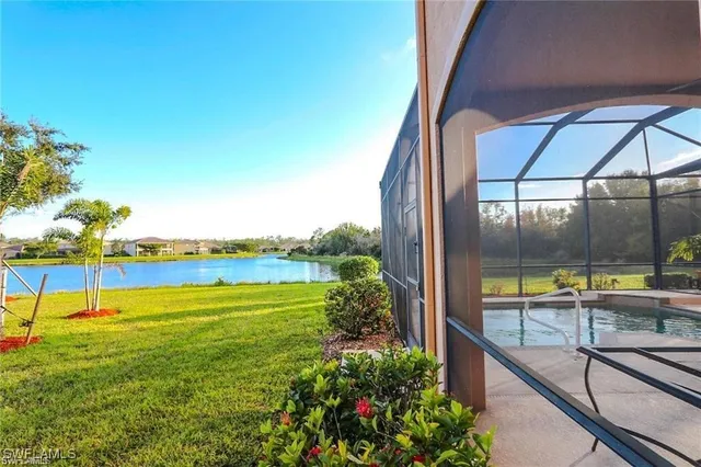 a view of a swimming pool with a lawn chairs
