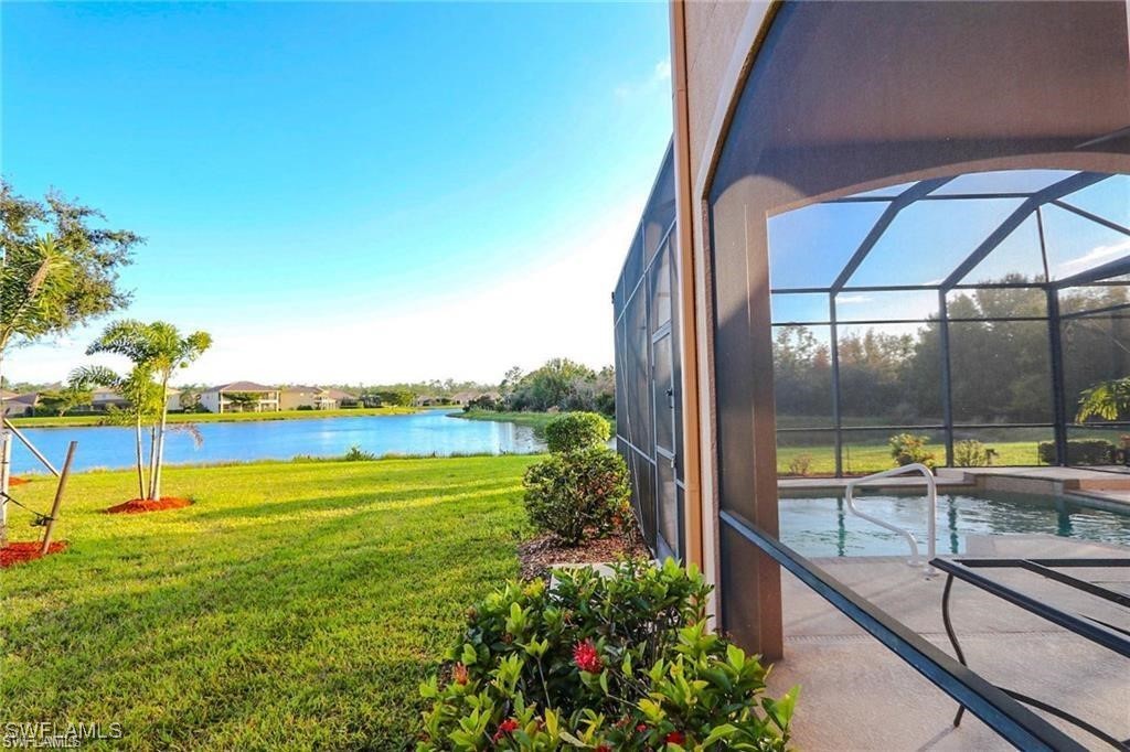 20056 Larino Loop Estero, FL 33928 - Photo 8 of 31 a view of a swimming pool with a lawn chairs