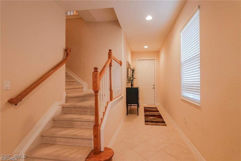 20056 Larino Loop Estero, FL 33928 - Photo 9 of 31 a view of an entryway with wooden floor