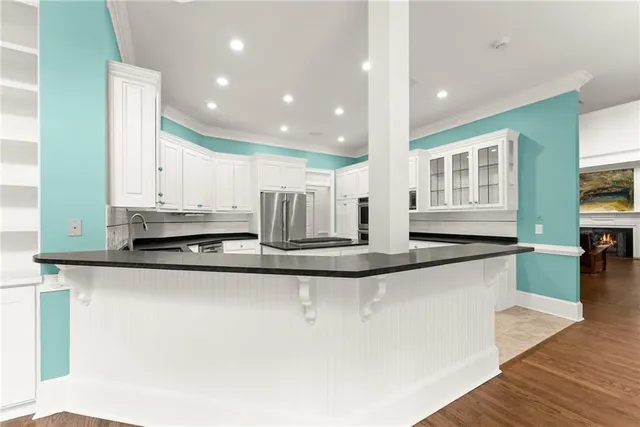 a bathroom with a tub shower and sink