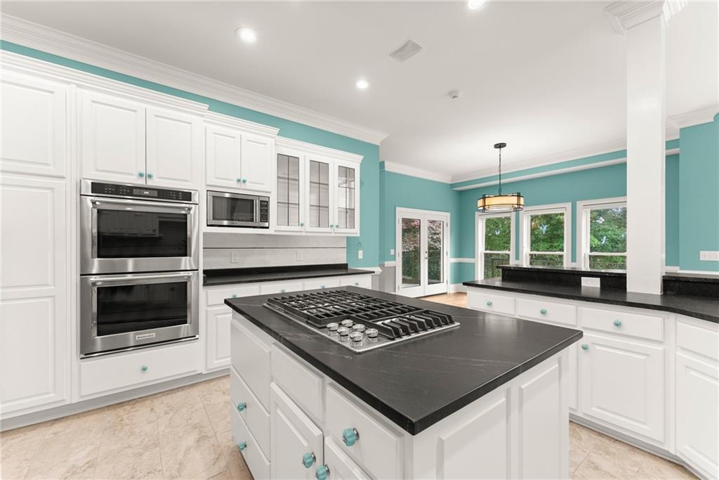 77 Old River Road Dahlonega, GA 30533 - Photo 27 of 98 a kitchen with stainless steel appliances granite countertop a stove a sink and a microwave