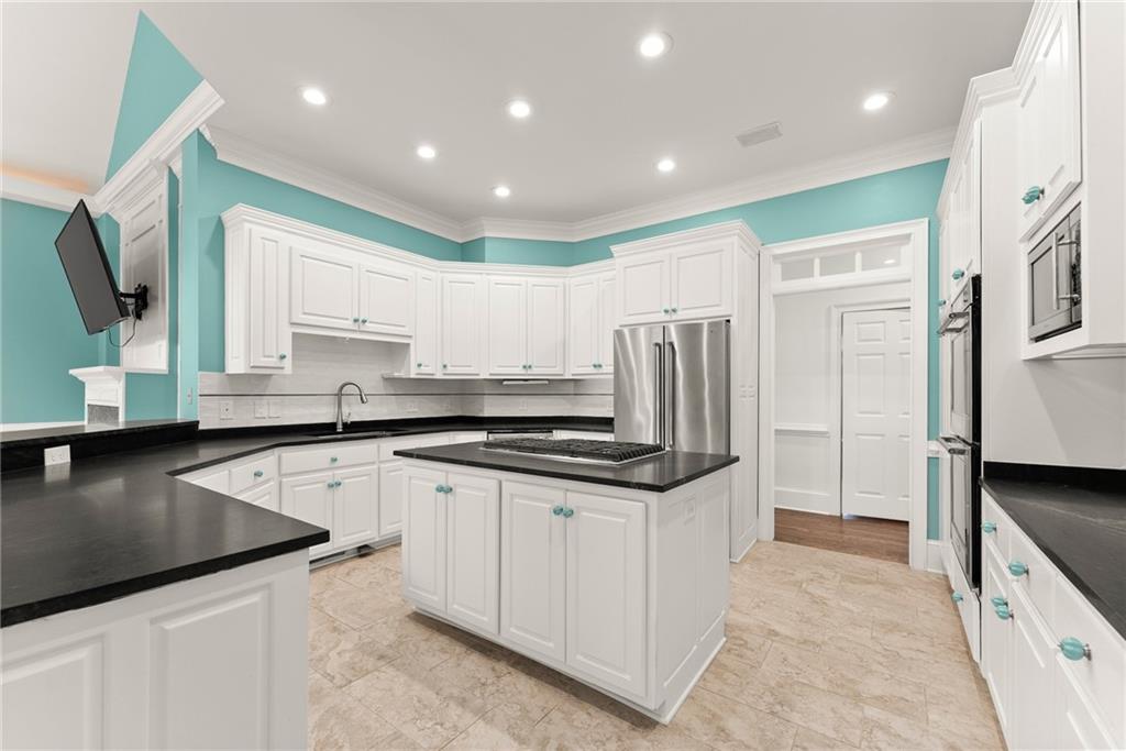 77 Old River Road Dahlonega, GA 30533 - Photo 28 of 98 a kitchen with stainless steel appliances granite countertop a sink and a refrigerator