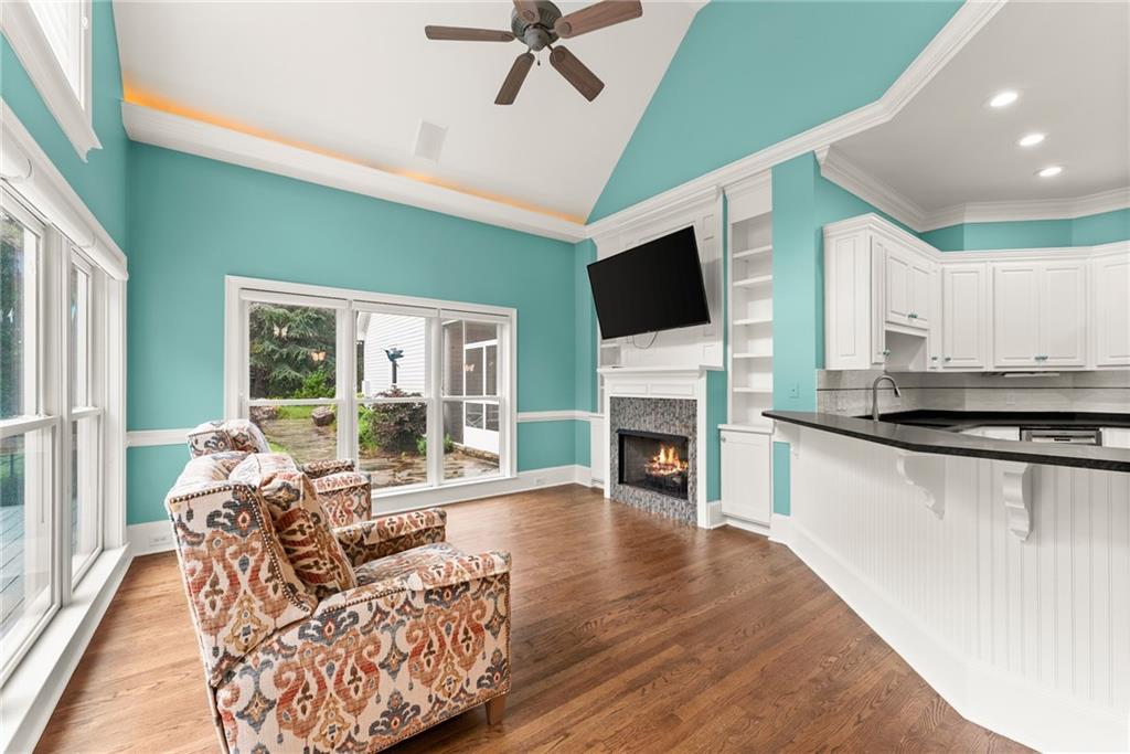 77 Old River Road Dahlonega, GA 30533 - Photo 30 of 98 a living room with furniture a fireplace and a flat screen tv