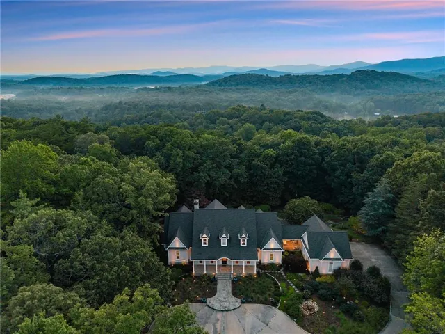 a view of a street with trees on both side of it