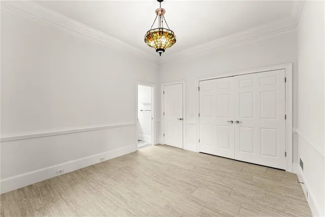a bathroom with a toilet a sink and a large mirror