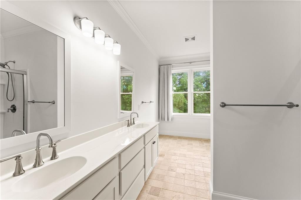 77 Old River Road Dahlonega, GA 30533 - Photo 58 of 98 a bathroom with a double vanity sink window and a bathtub