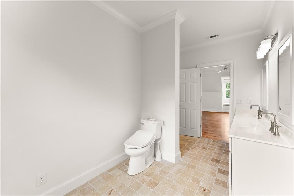 77 Old River Road Dahlonega, GA 30533 - Photo 60 of 98 a bathroom with a toilet sink and mirror