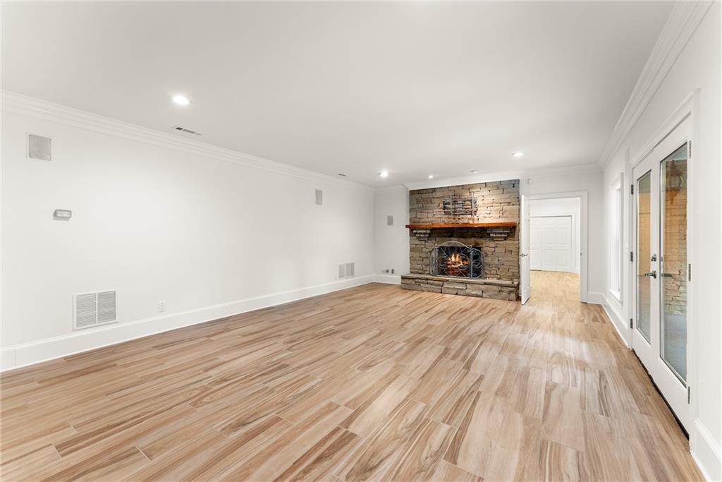 77 Old River Road Dahlonega, GA 30533 - Photo 68 of 98 a view of empty room with wooden floor and fireplace