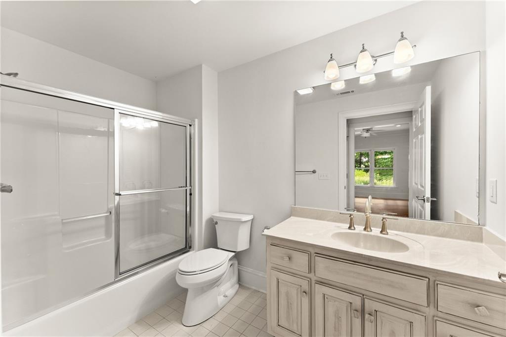 77 Old River Road Dahlonega, GA 30533 - Photo 70 of 98 a bathroom with a toilet a sink and a large mirror