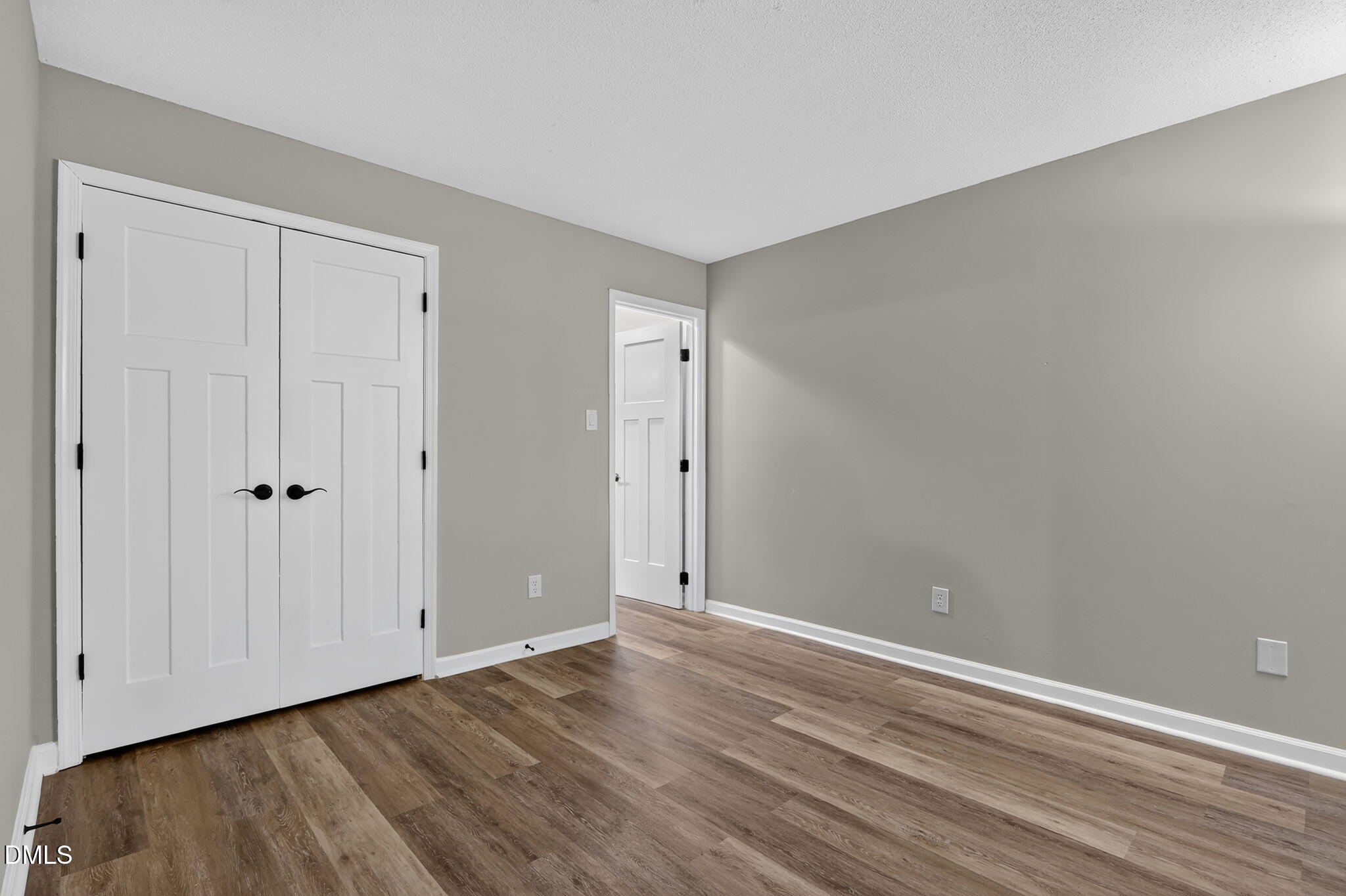 3425 Mill Run Raleigh, NC 27612 - Photo 20 of 40 a view of an empty room with wooden floor