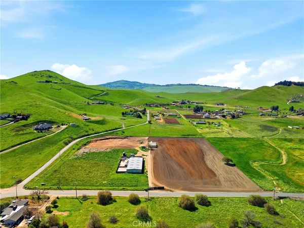 an aerial view of a golf course with parking space
