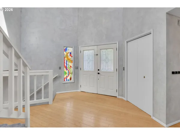 a view of an entryway with wooden floor