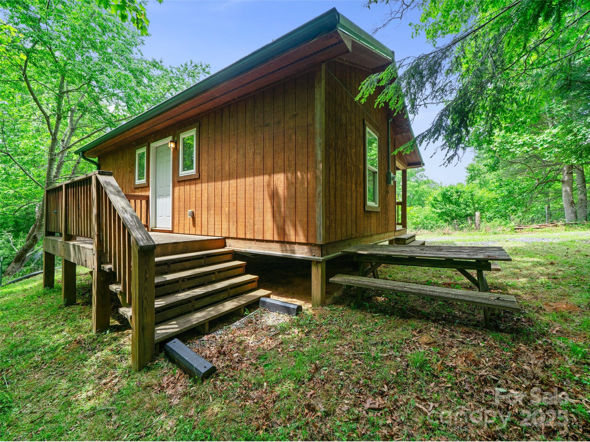 289 Bailey Settlement Road Green Mountain, NC 28740 - Photo 11 of 21 a view of a house with a yard