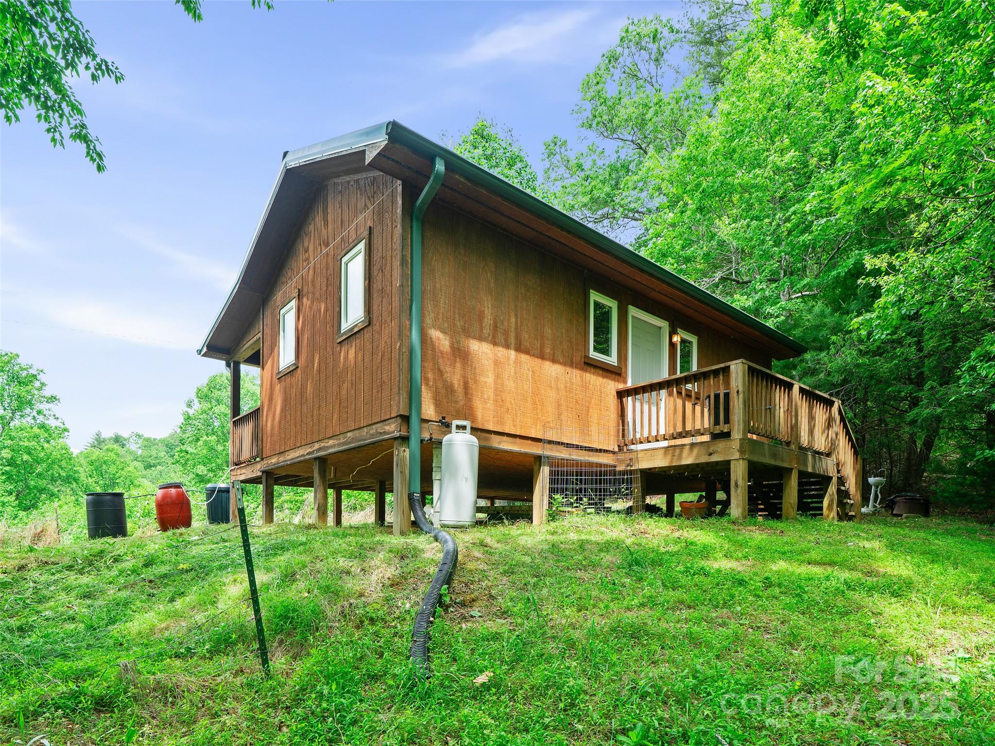 289 Bailey Settlement Road Green Mountain, NC 28740 - Photo 12 of 21 a house that has a lot of plants in it