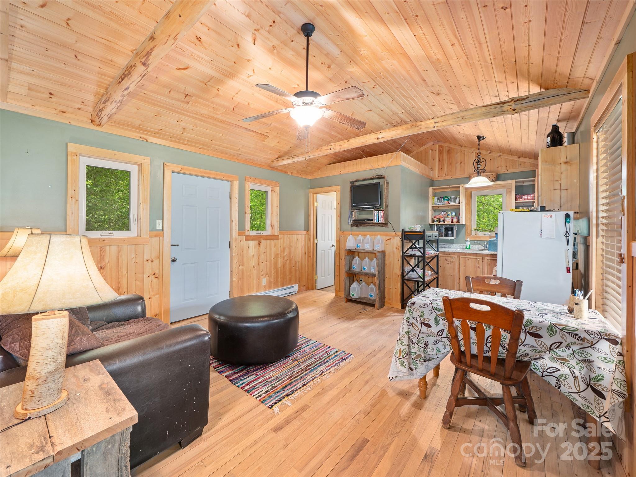 289 Bailey Settlement Road Green Mountain, NC 28740 - Photo 2 of 21 a living room with furniture and a wooden floor