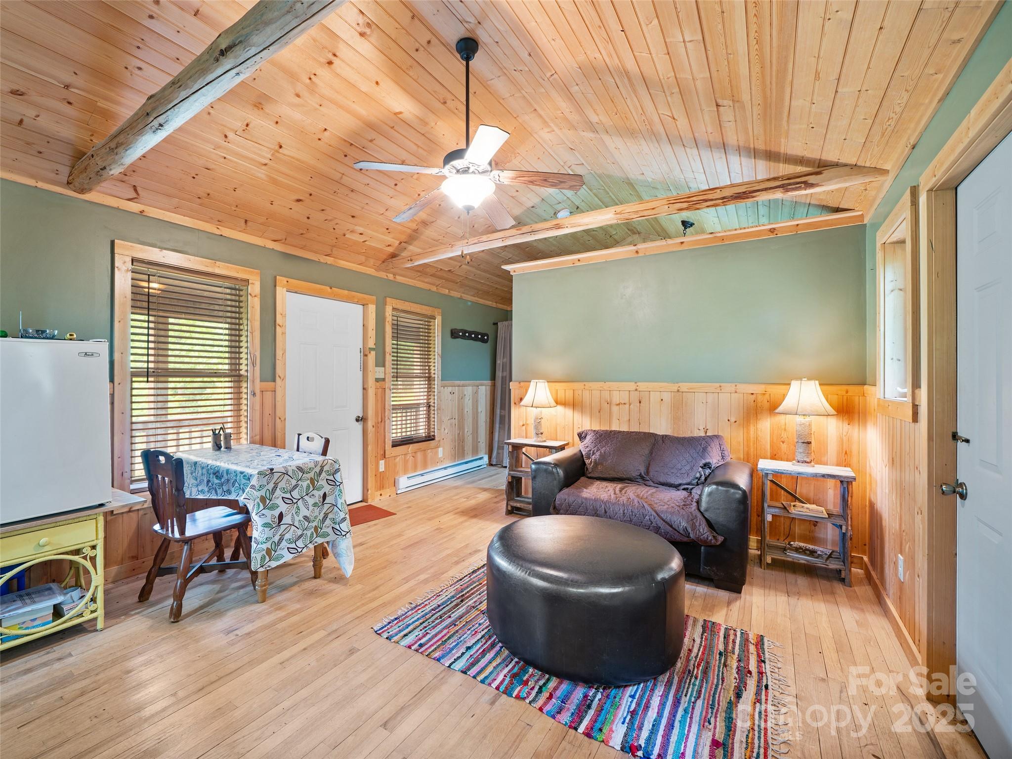 289 Bailey Settlement Road Green Mountain, NC 28740 - Photo 3 of 21 a living room with furniture and a wooden floor