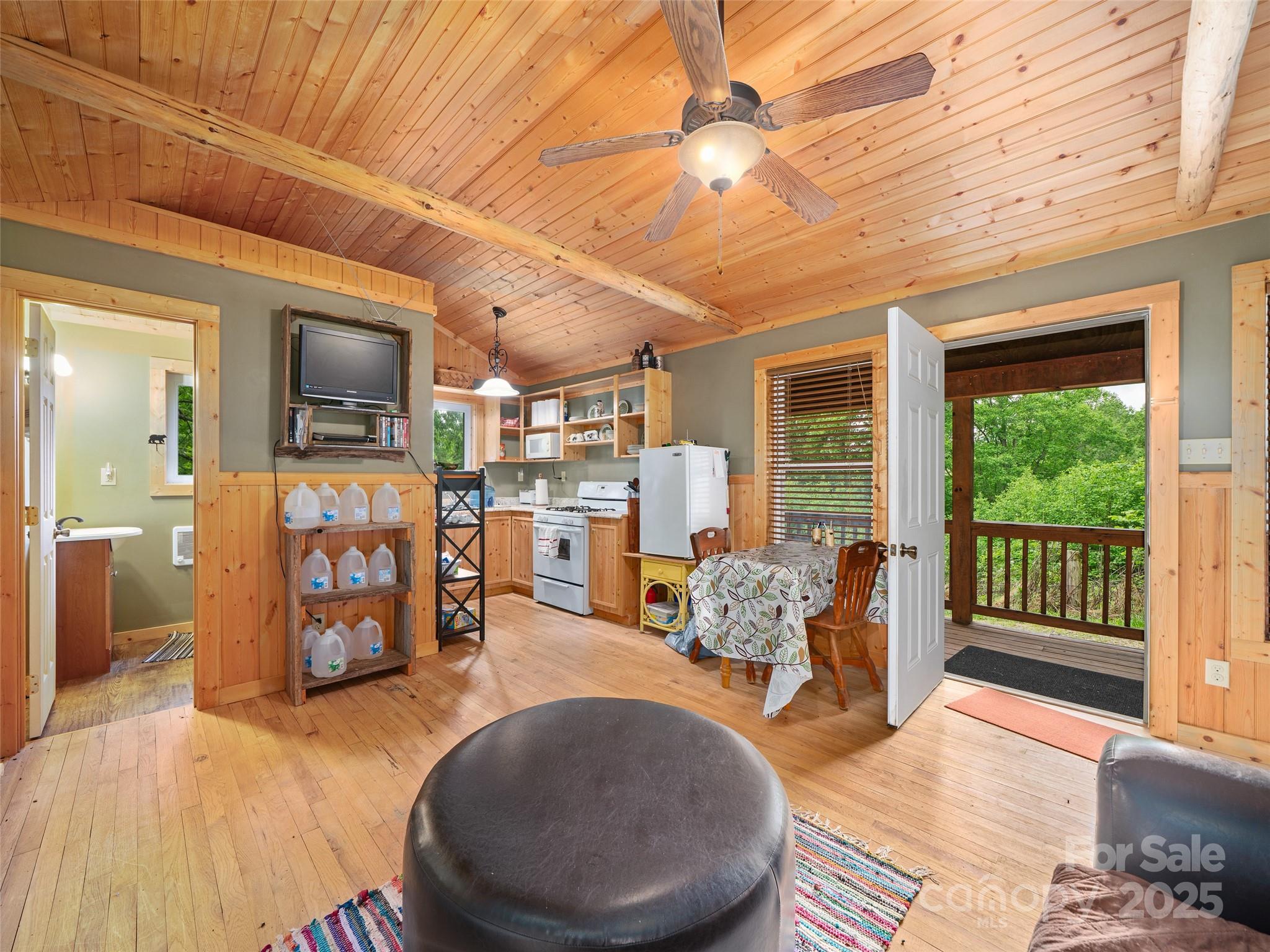 289 Bailey Settlement Road Green Mountain, NC 28740 - Photo 4 of 21 a living room with furniture and a wooden floor