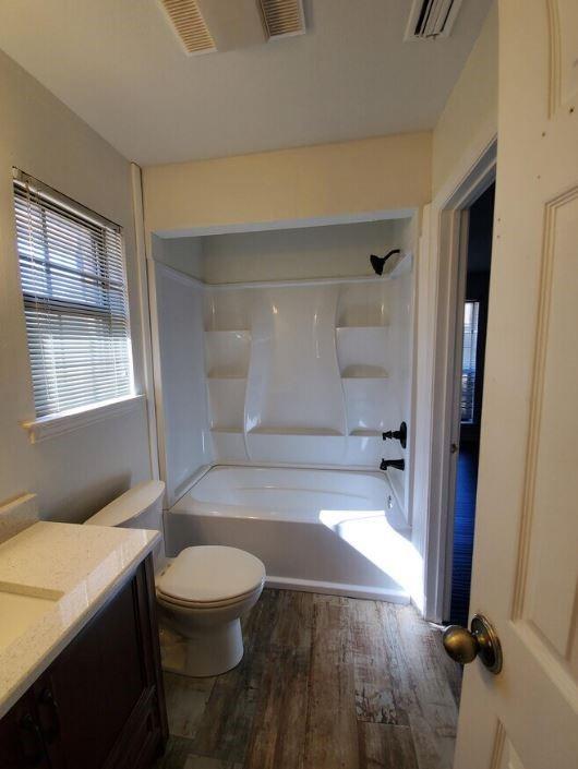 10948 Fm 898 Whitewright, TX 75491 - Photo 31 of 39 a bathroom with a toilet and a shower
