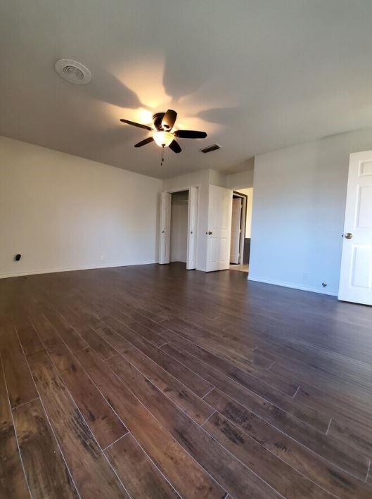 10948 Fm 898 Whitewright, TX 75491 - Photo 33 of 39 a view of an empty room with wooden floor and a ceiling fan