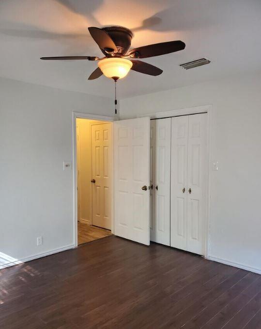 10948 Fm 898 Whitewright, TX 75491 - Photo 34 of 39 an empty room with wooden floor fan and windows