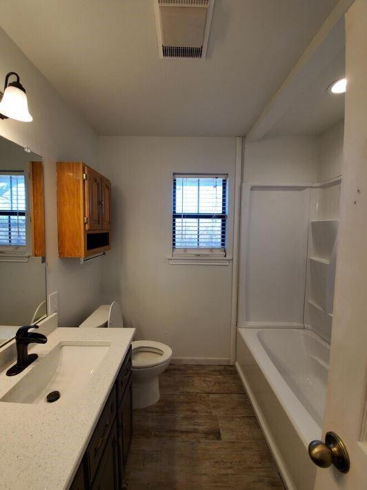 10948 Fm 898 Whitewright, TX 75491 - Photo 37 of 39 a bathroom with a sink a toilet and shower