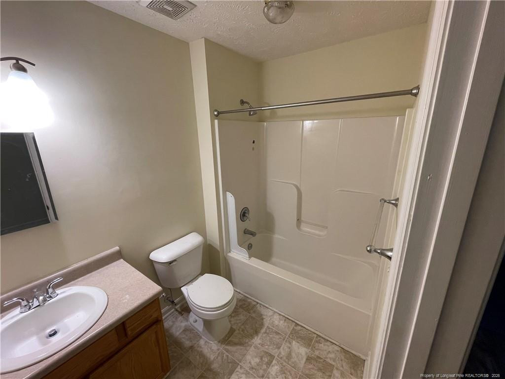 522 Longview Drive, Unit B Fayetteville, NC 28311 - Photo 8 of 10 a bathroom with a sink toilet and shower