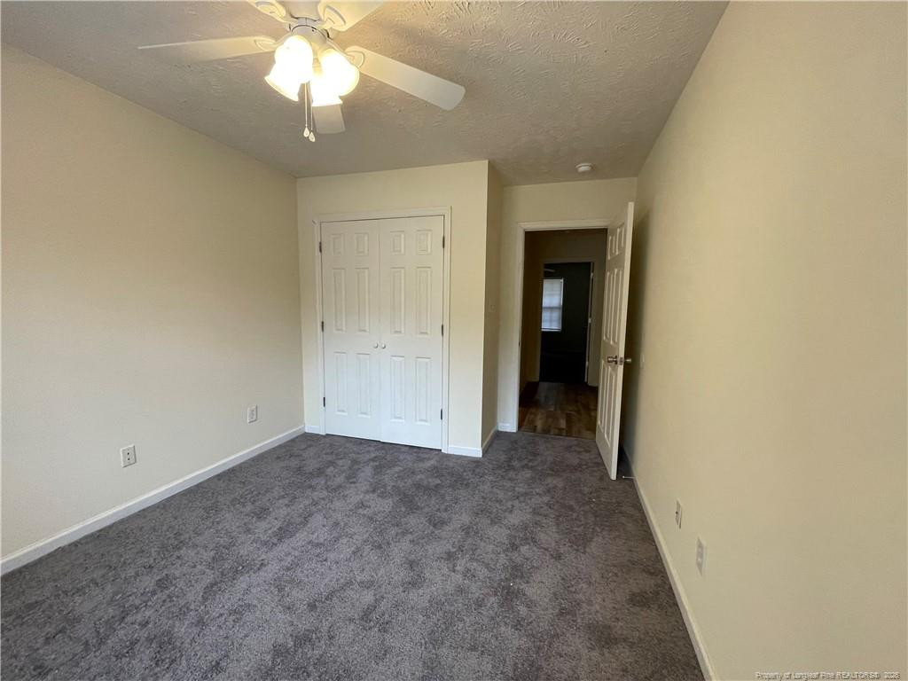 522 Longview Drive, Unit B Fayetteville, NC 28311 - Photo 10 of 10 a view of an empty room with window and chandelier fan