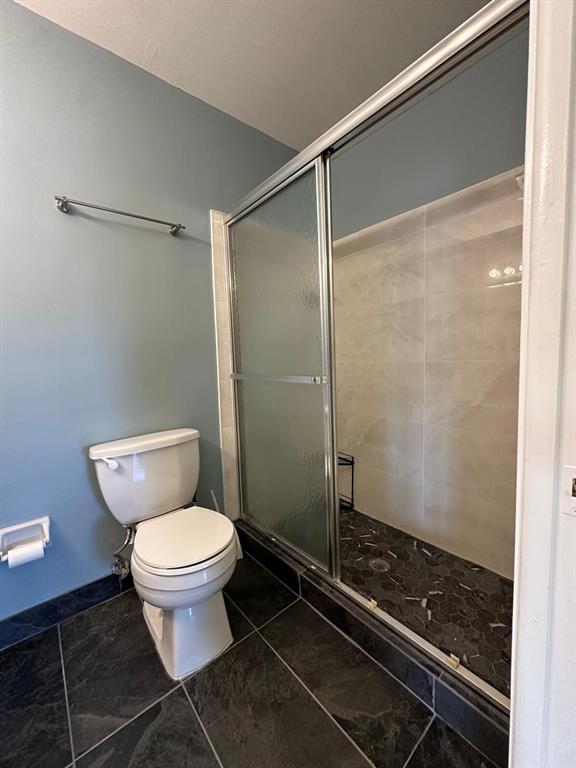 665 High Point Drive Delray Beach, FL 33445 - Photo 11 of 22 a bathroom with a toilet and a shower