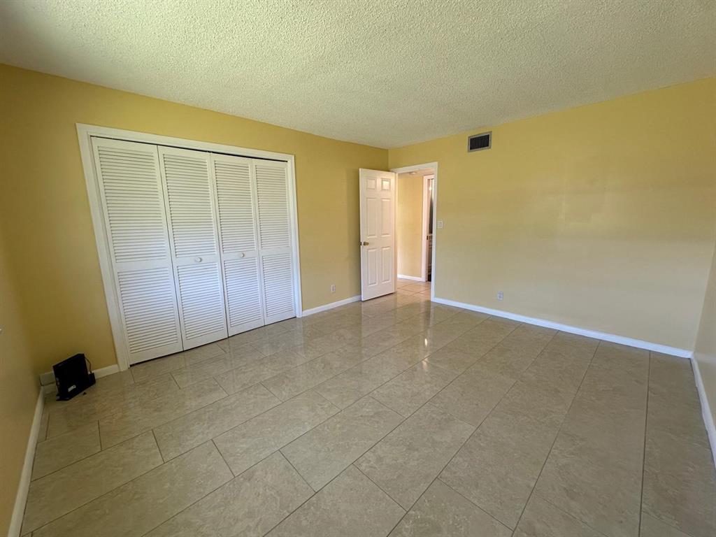 665 High Point Drive Delray Beach, FL 33445 - Photo 12 of 22 a view of an empty room