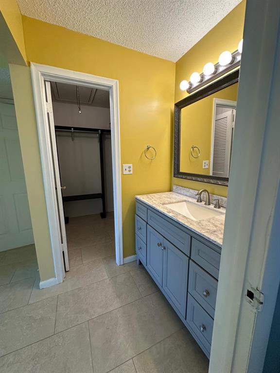 665 High Point Drive Delray Beach, FL 33445 - Photo 15 of 22 a bathroom with a granite countertop sink mirror and toilet