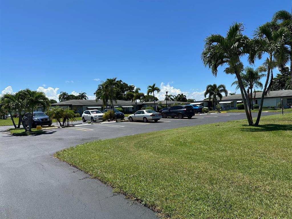 665 High Point Drive Delray Beach, FL 33445 - Photo 21 of 22 a view of street with parked cars