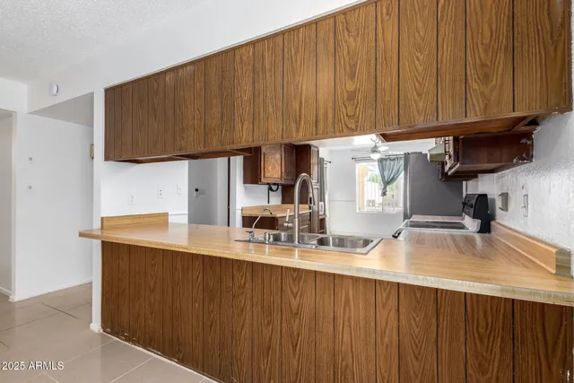a kitchen with a sink and cabinets
