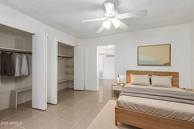 a bedroom with a bed and a walk in closet