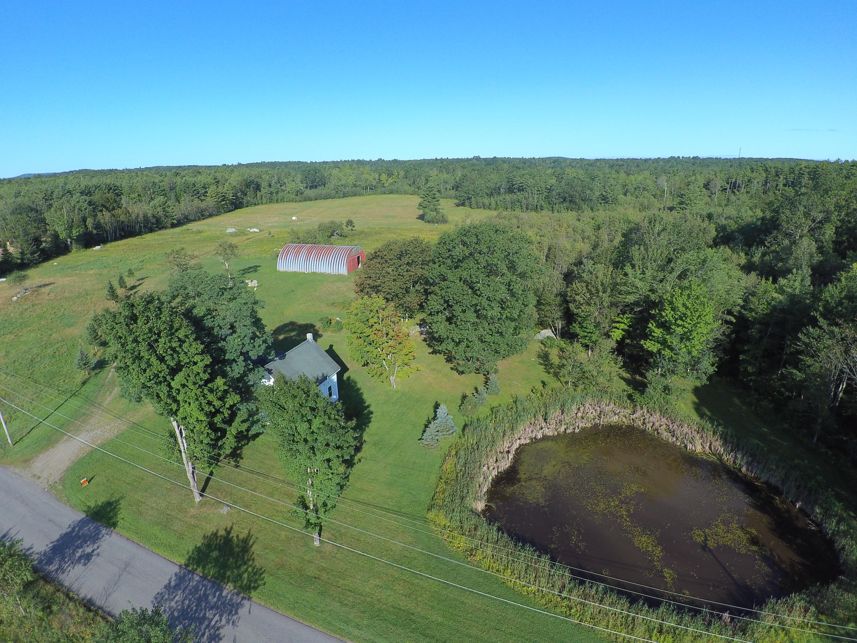 390 Howe Road Whitefield, ME 04353 - Photo 32 of 40 WillrodtAerialPond