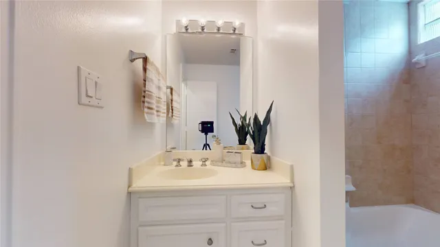 a bathroom with a toilet a sink and bathtub