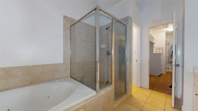 a bathroom with a double vanity sink mirror and shower