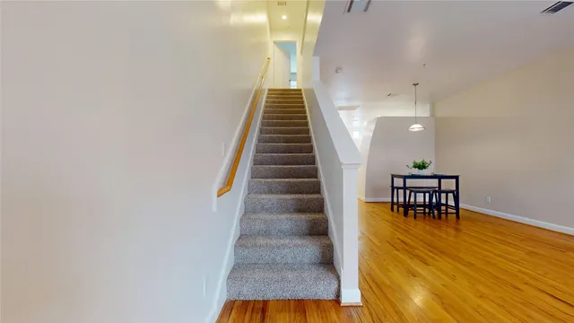 a view of empty room and wooden floor