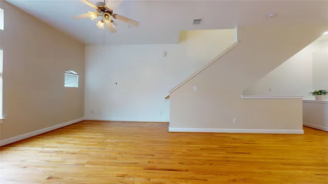 a view of a room with wooden floor